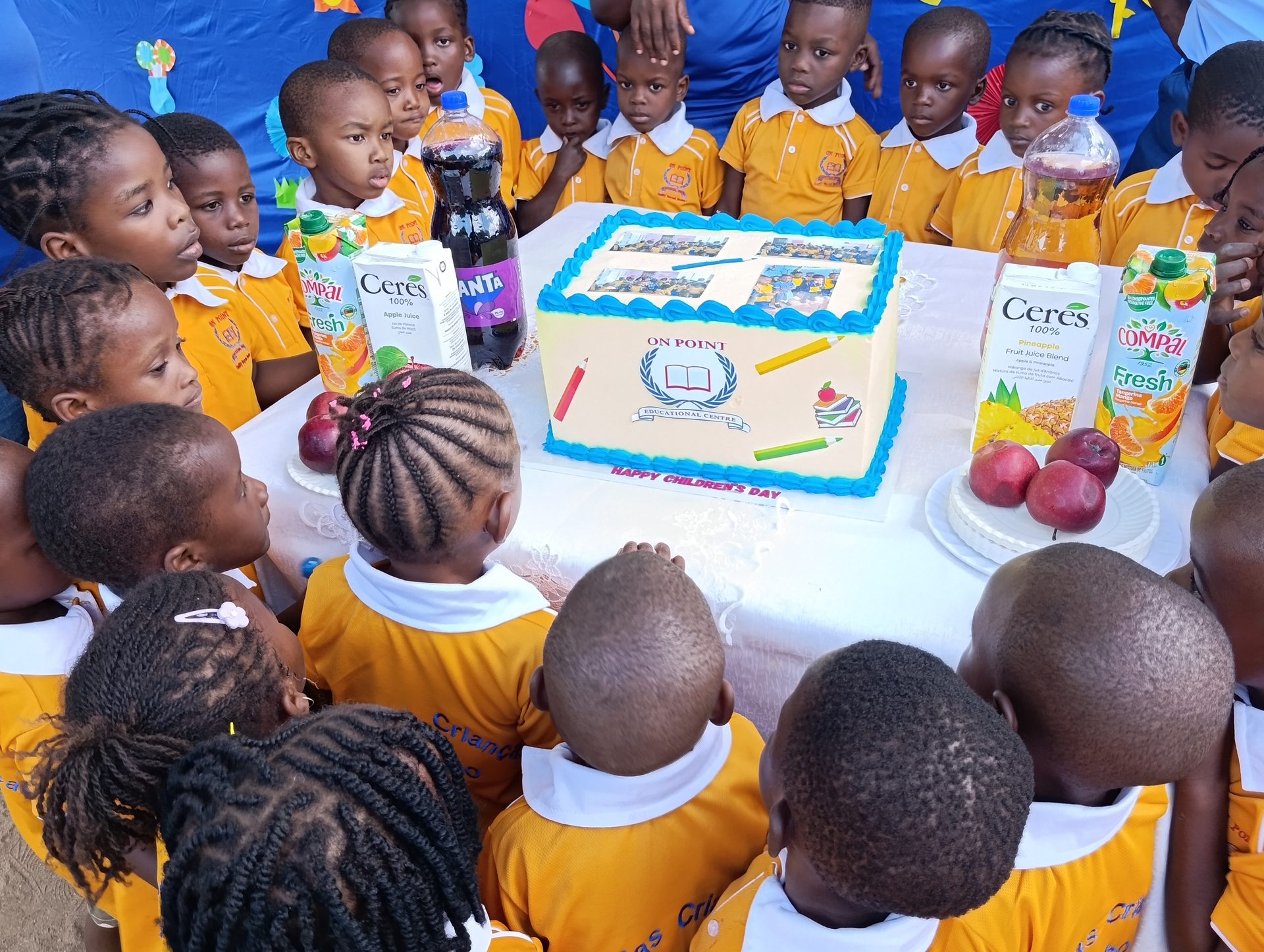Cutting the cake at the On Point Children's Day celebration