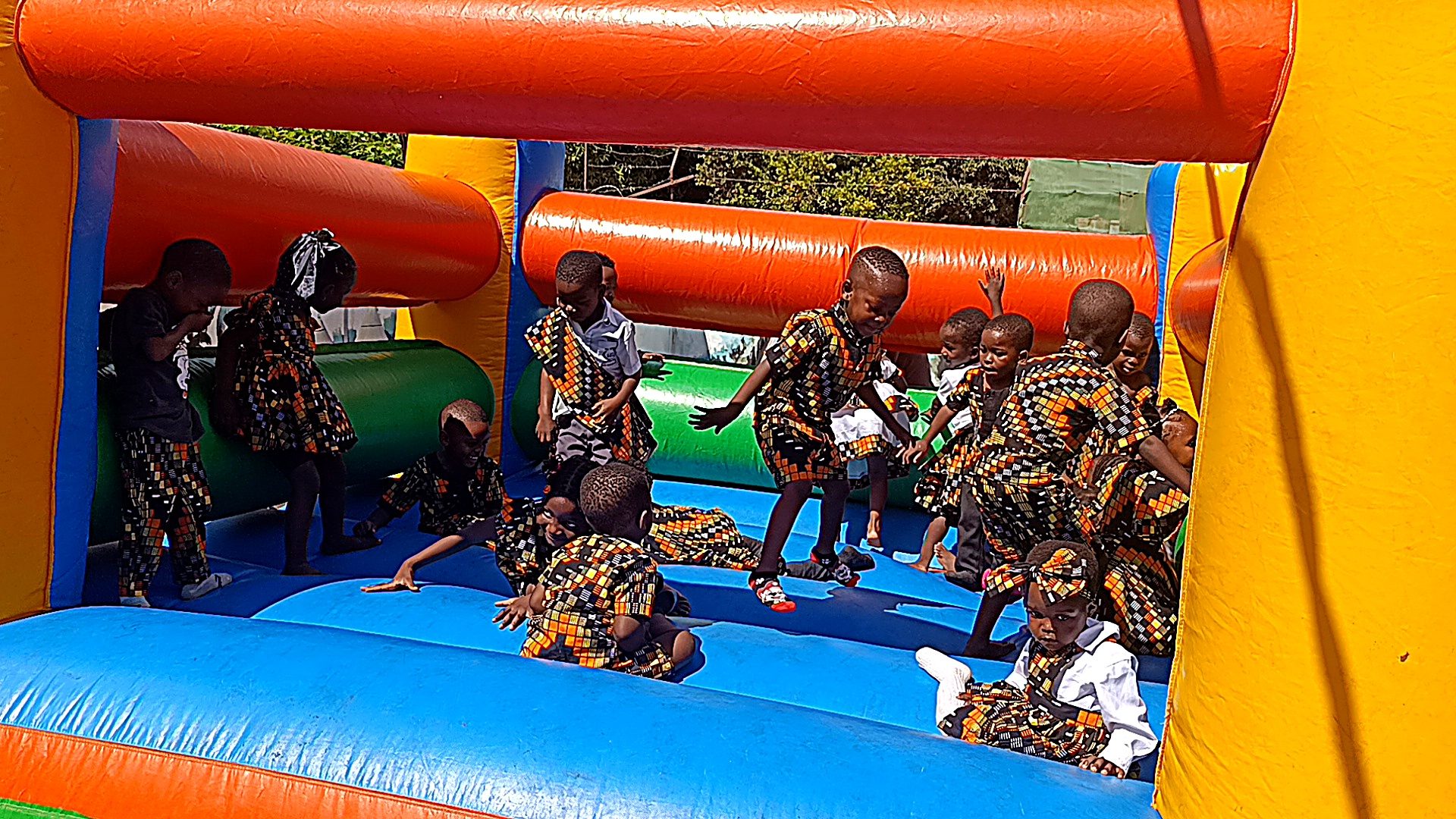 Learners playing on the jumping castle at On Point Education Centre